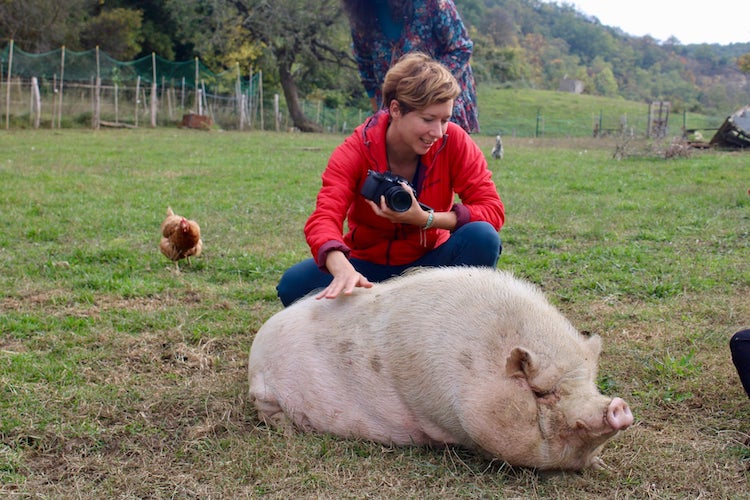 Charlotte with a pig